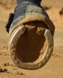 A heel covered in sand