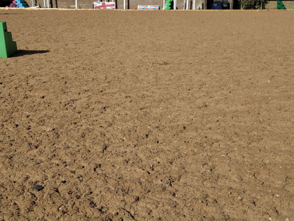 Waxed sand in a riding arena